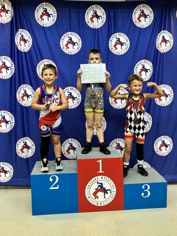 WWC wrestlers on the podium