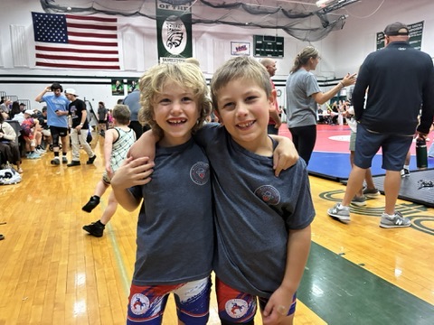 Two WWC wrestlers smiling at a tournament