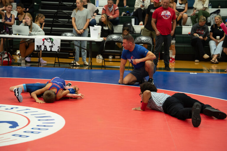 A match underway on the mat at a tournament