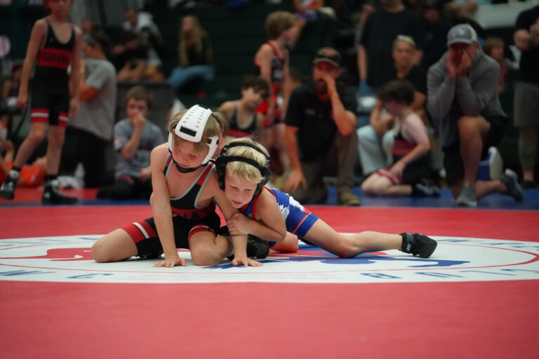 A match in progress with teammates watching