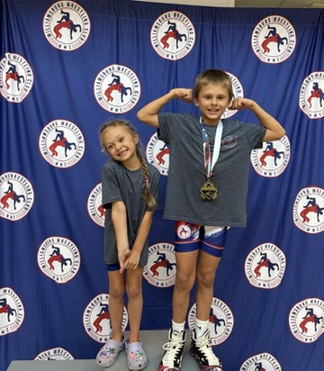 WWC wrestlers celebrating on the podium
